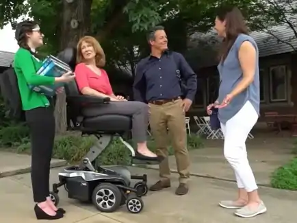 Person confidently using the Pride Jazzy Air 2 elevated power wheelchair