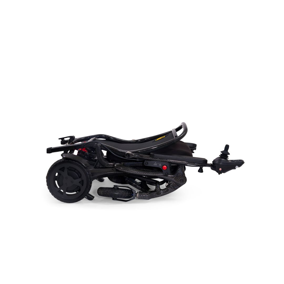 Cricket folding power wheelchair navigating indoors, slim 22.5 inch width